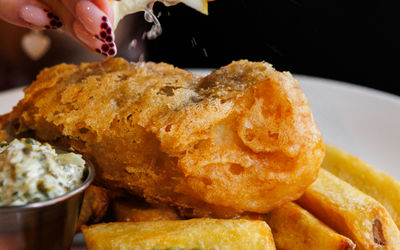 Fish and chips, mushy pes and tartare sauce, with a wedge of lemon. At The North Star Brighton