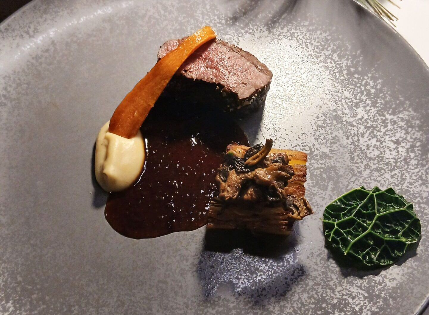 venison with potato and celeriac presse served on grey plate and during A Sussex Fine Dining Experience at Terra, Tottington Manor