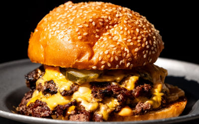 Incredible double stacked burger at Sea Lanes Brighton, Sesame bun with lots of melting cheese. Brighton Burger, Brighton seafront, by Dan Cotton.