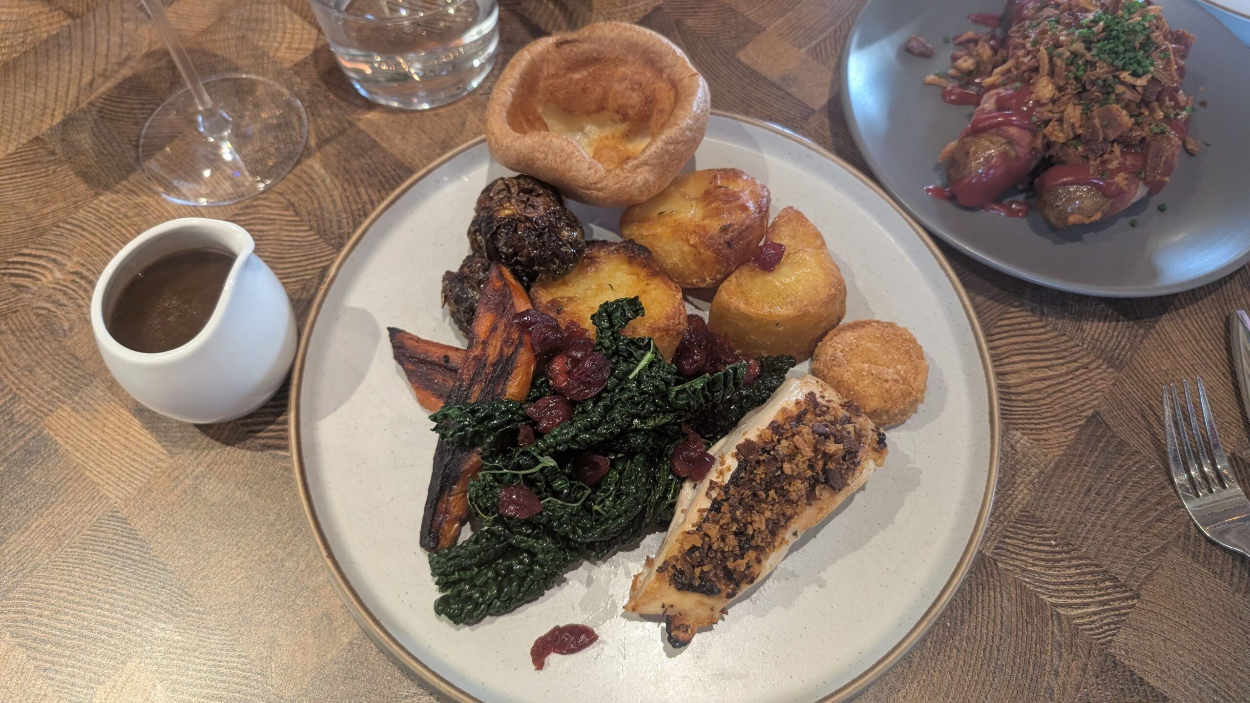 over head shot of the plate with sunday roast served with gravy
