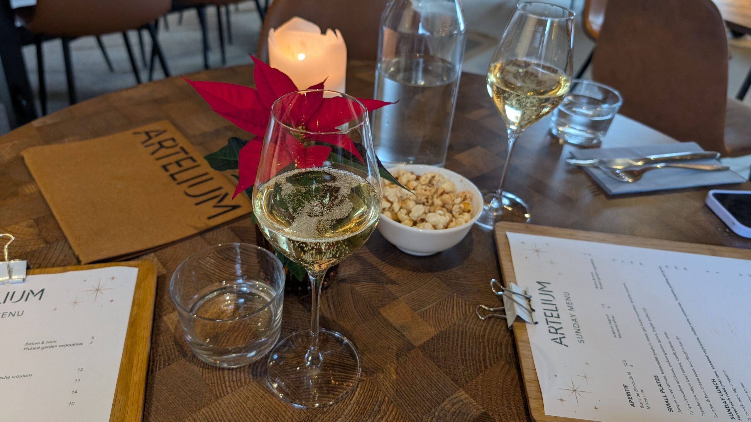 two glasses of wine served with popcorn