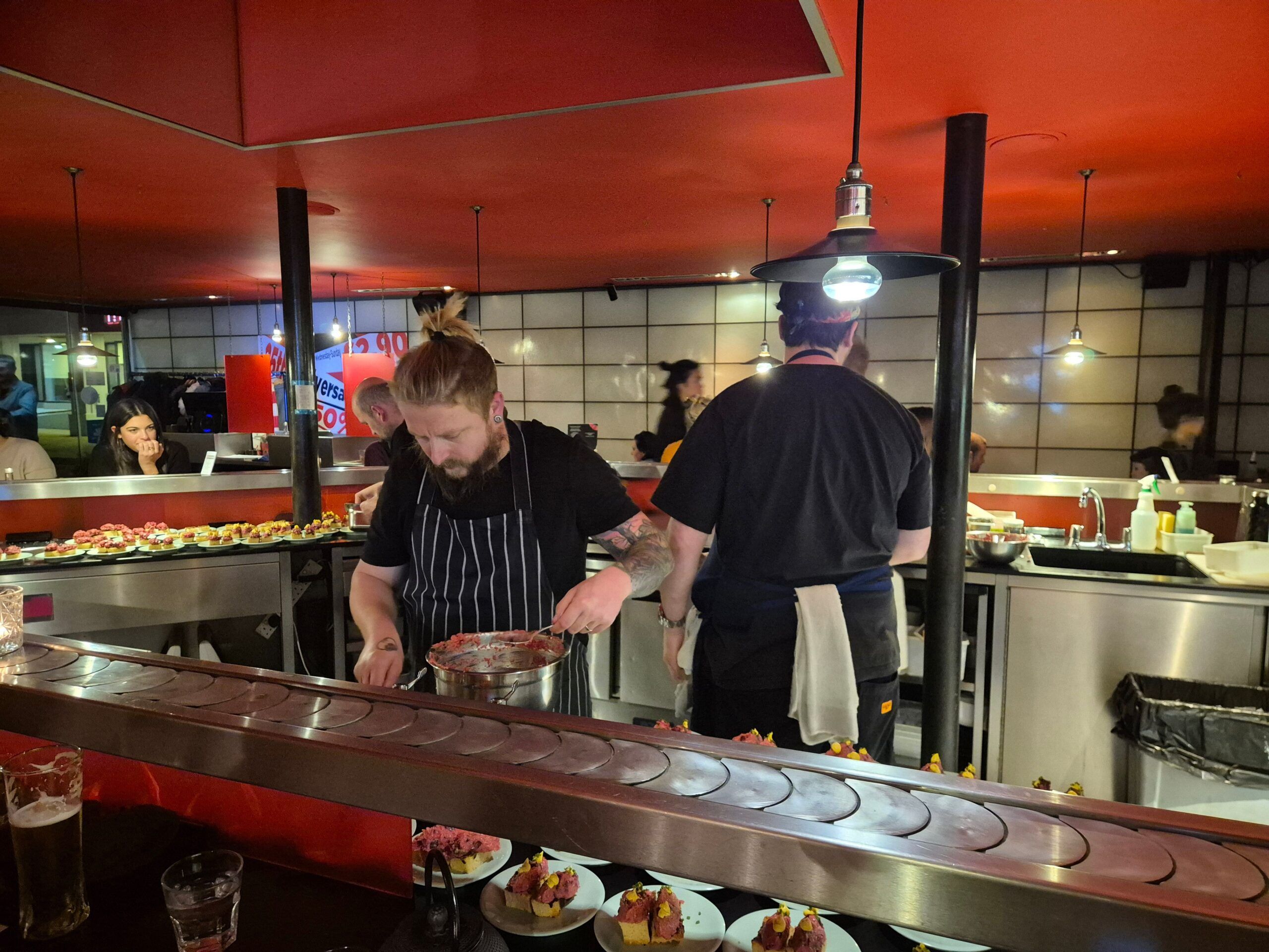 chefs preparing food in the Moshimo Kitchen