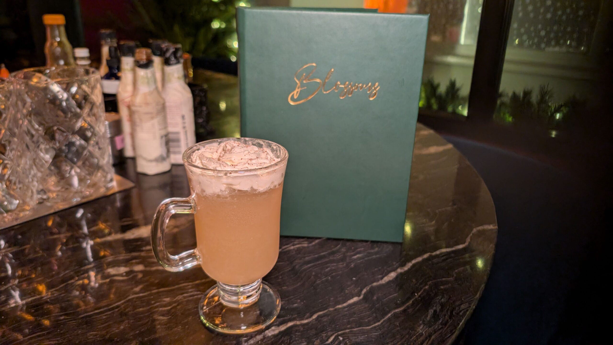 Kyoto Cloud, a concoction of bourbon, spiced pumpkin liqueur, butter-washed Tuaca and cream soda, topped with whipped cream