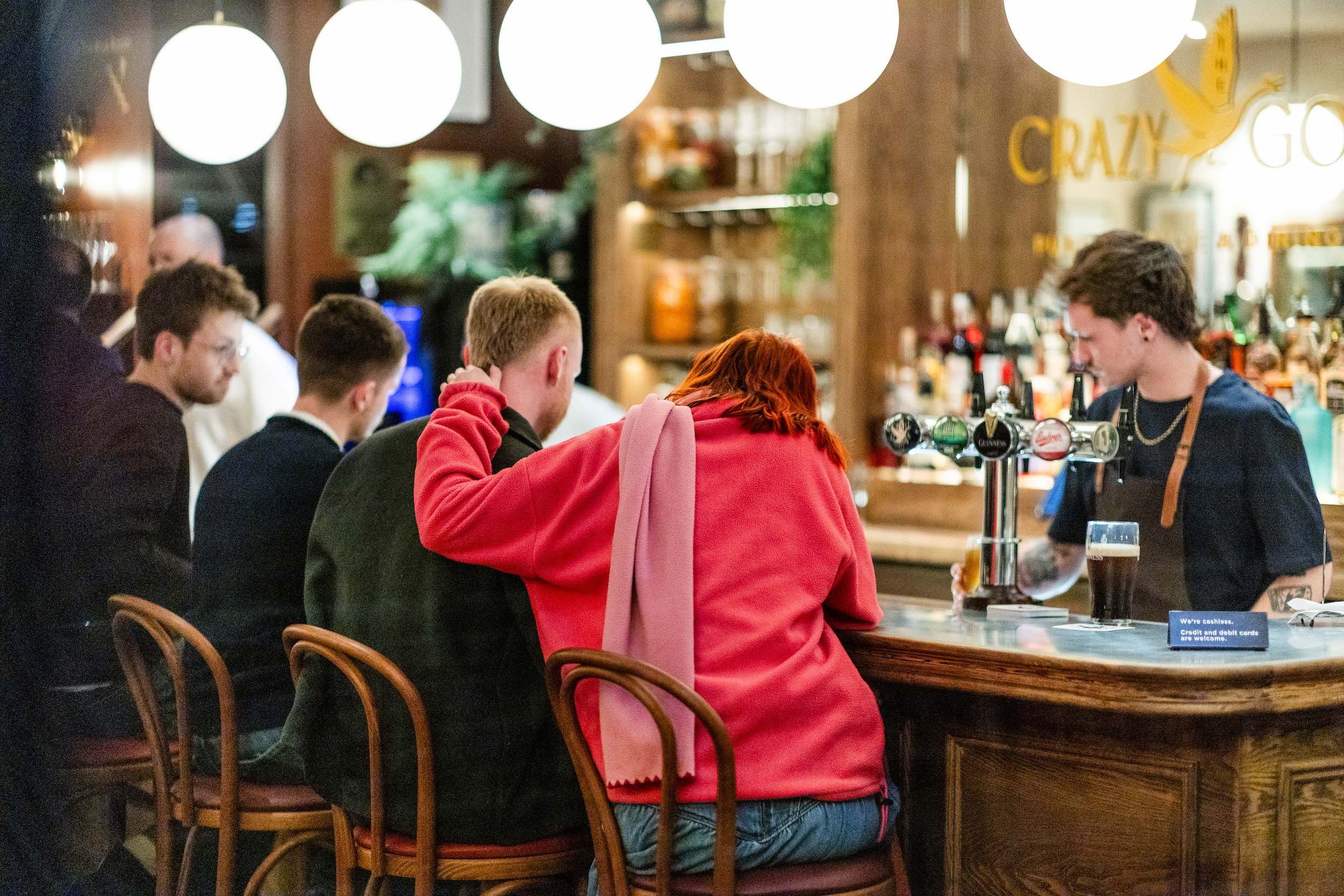 Diners enjoying a pint at the Crazy Goose pub in Brighton
