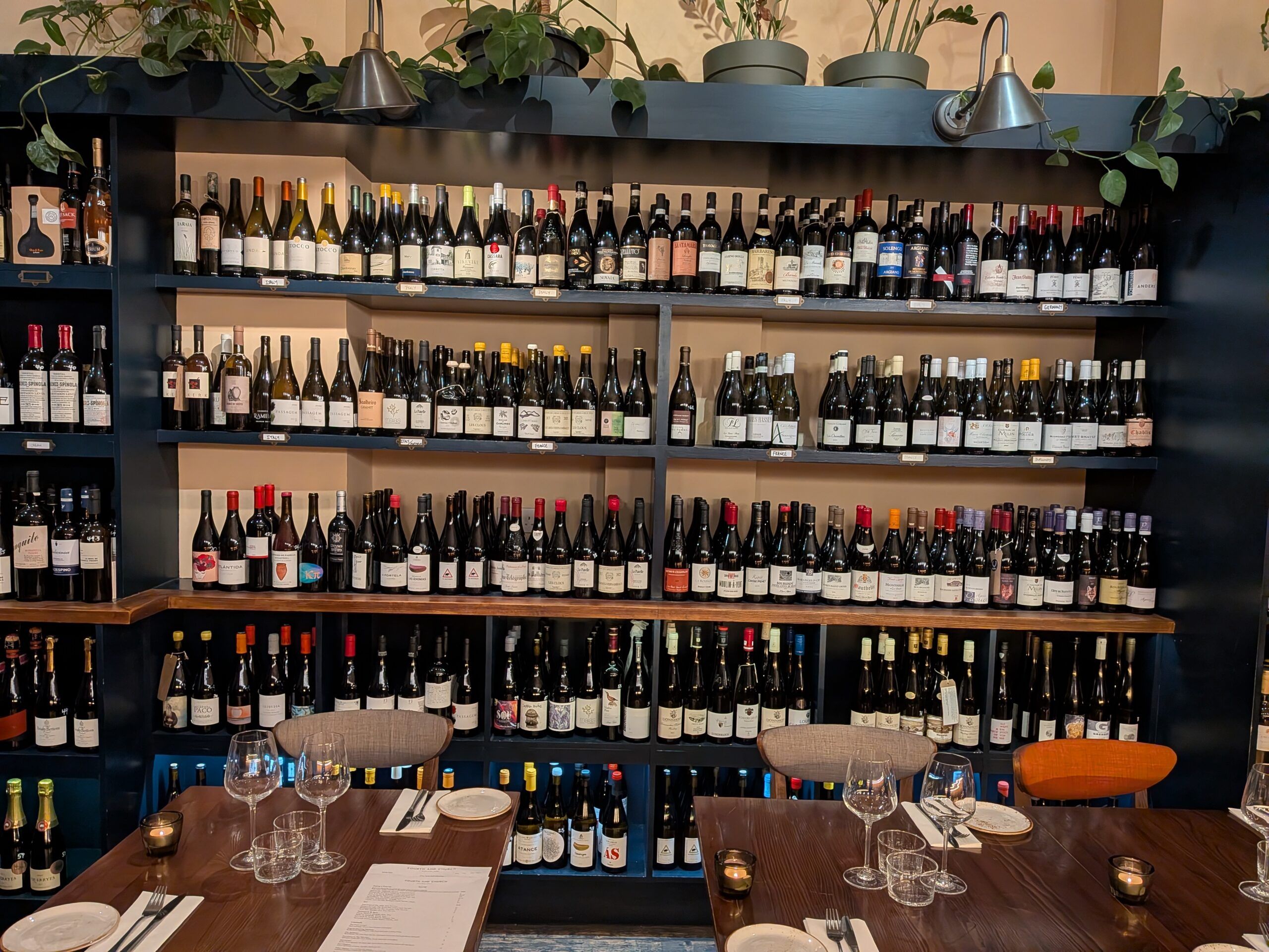 hundreds of wine bottles lined up on the shelf at Fourth and Church