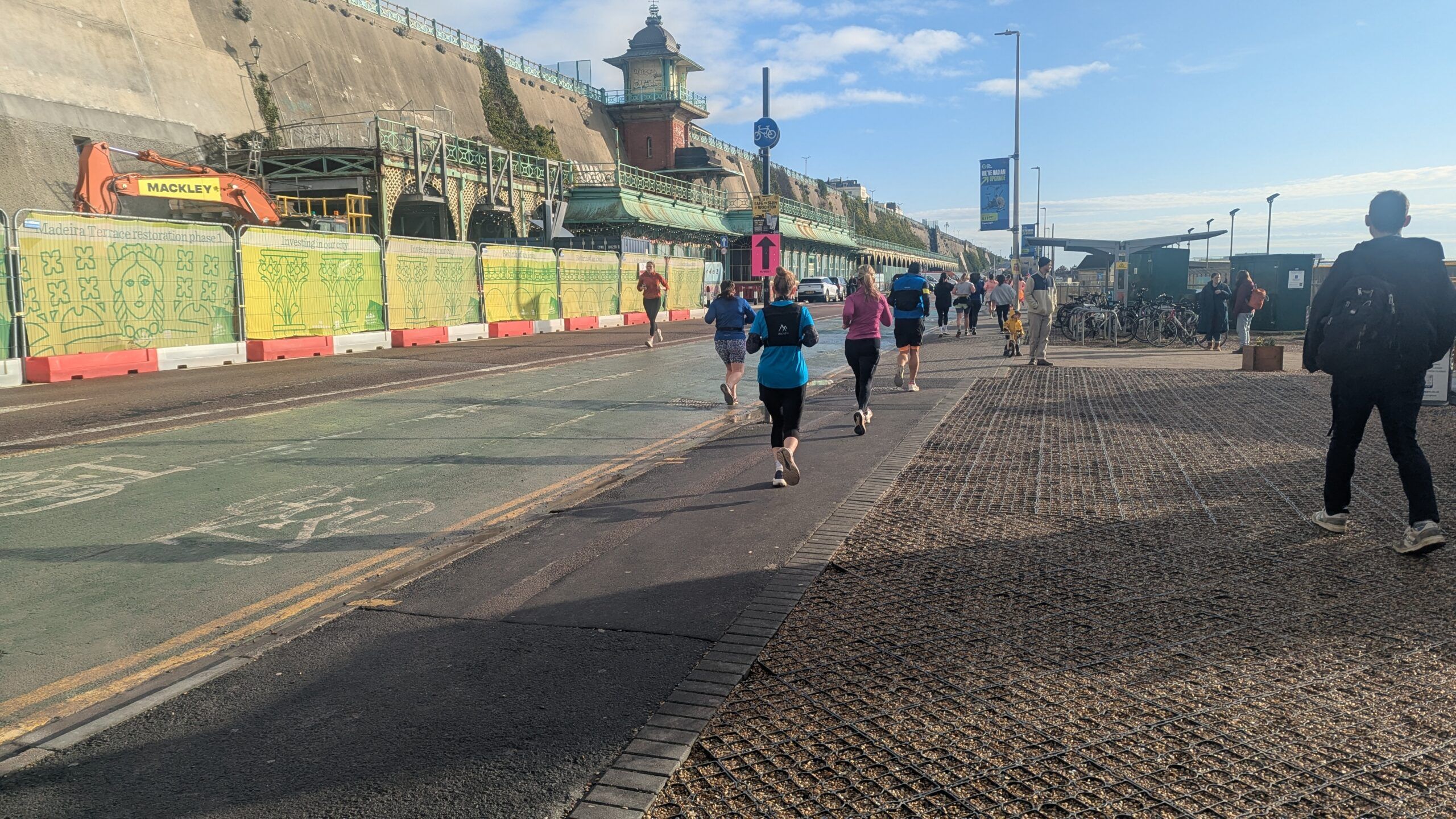 people running on the brighton seafront