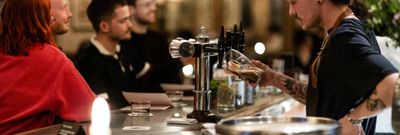 Bar person facing customers in this Brighton pub. New in 2025, The Crazy Goose