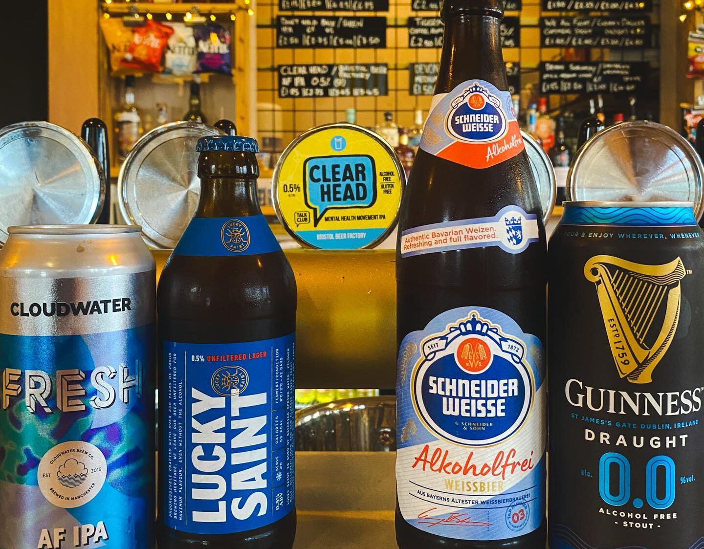 four different beers on the bar