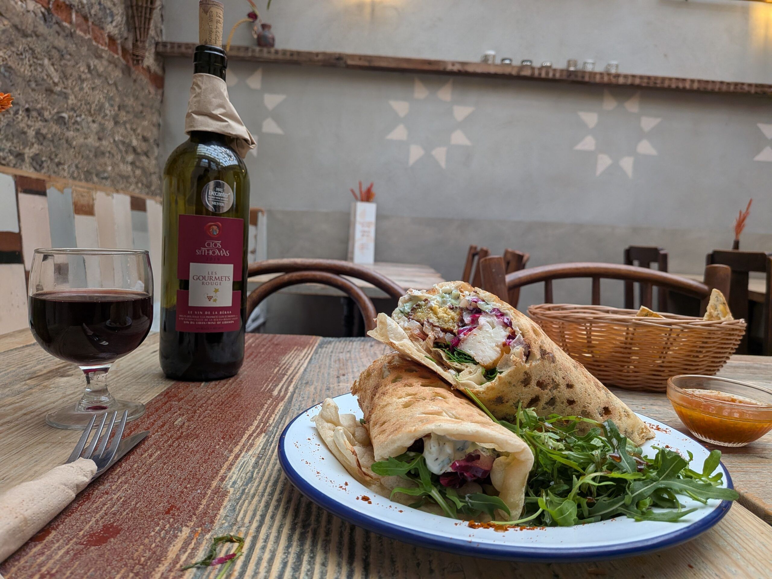 grilled haloumi wrap served with red wine at Lavash Brighton, celebrating Middle Eastern cousine