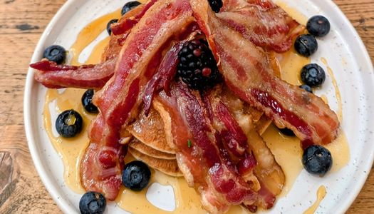 delicious pancakes with bacon, maple syrup and berries. Featured on our Kemptown restaurants page.