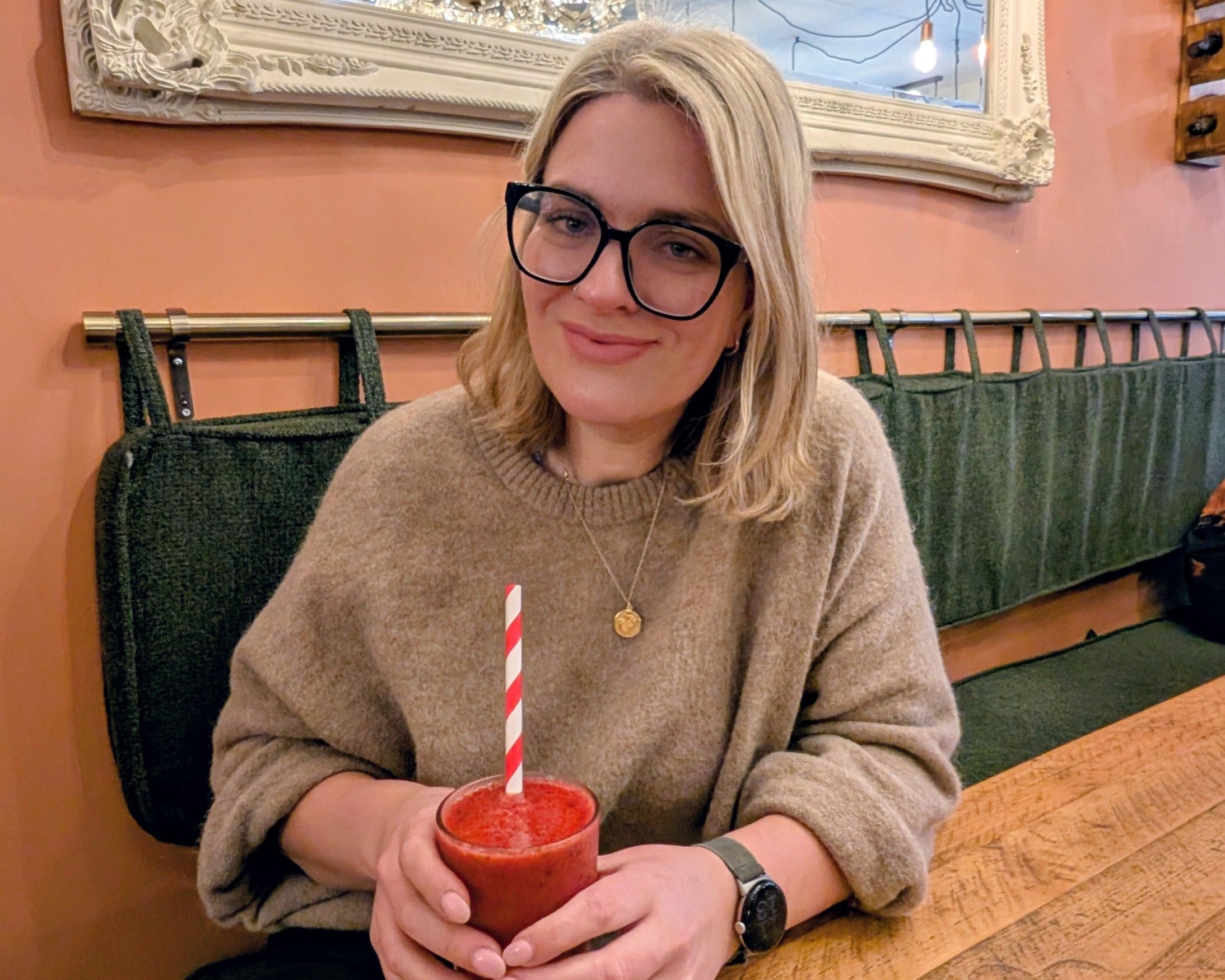 Mari holding a berry drink