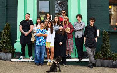 the team at The Signalman in Brighton. Celebrating the accolade of best Brighton Pub. Green facade. Located near to London Road station and Preston Circus.