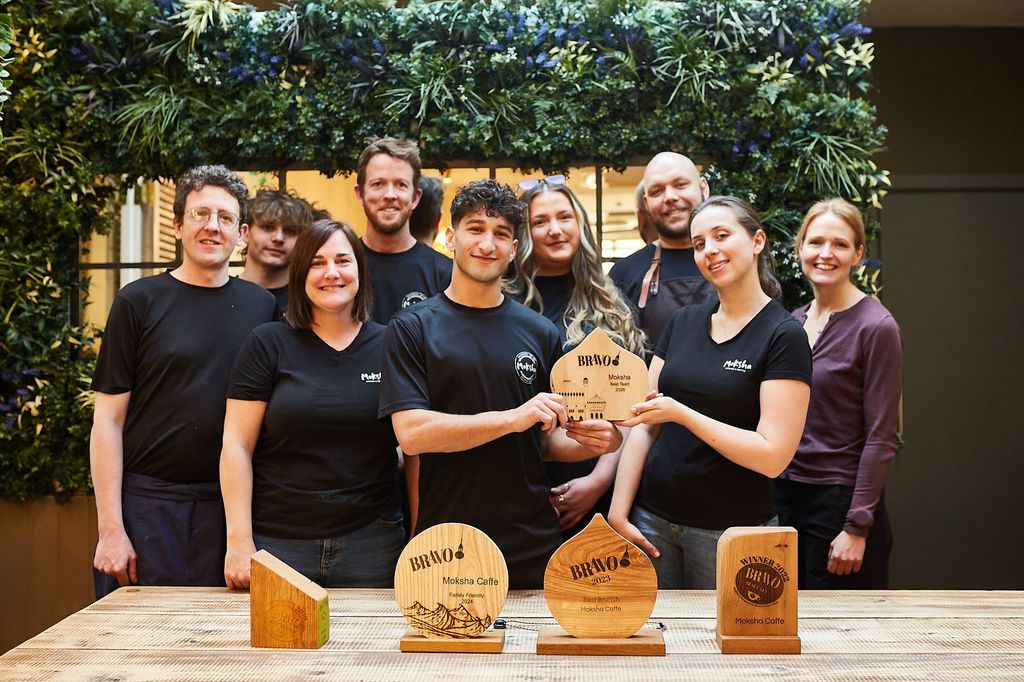 Best Team Brighton - Moksha on York Place. Multi-award winning venue, voted best BRAVO team in 2026. The team holding trophies designed by Designs Woodcraft. Also runner up in Best For The Maily awards.