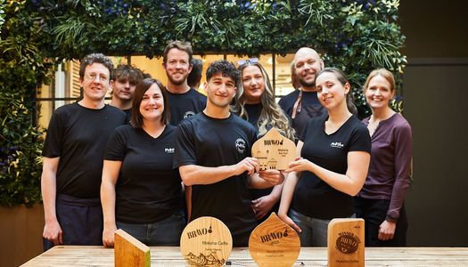 Best Team Brighton - Moksha on York Place. Multi-award winning venue, voted best BRAVO team in 2026. The team holding trophies designed by Designs Woodcraft. Also runner up in Best For The Maily awards.