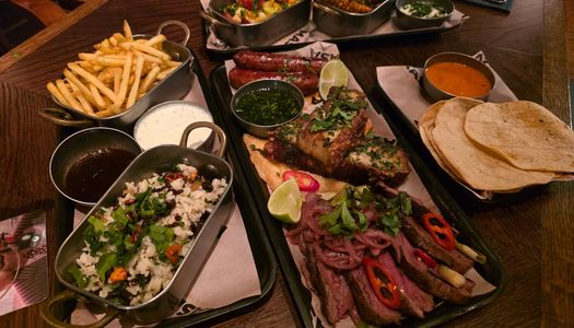 over head shot of table laid out with platter of mexican food