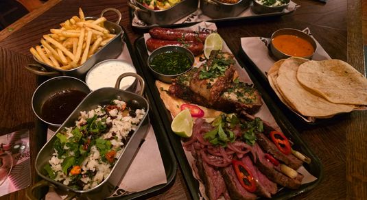 over head shot of table laid out with platter of mexican food