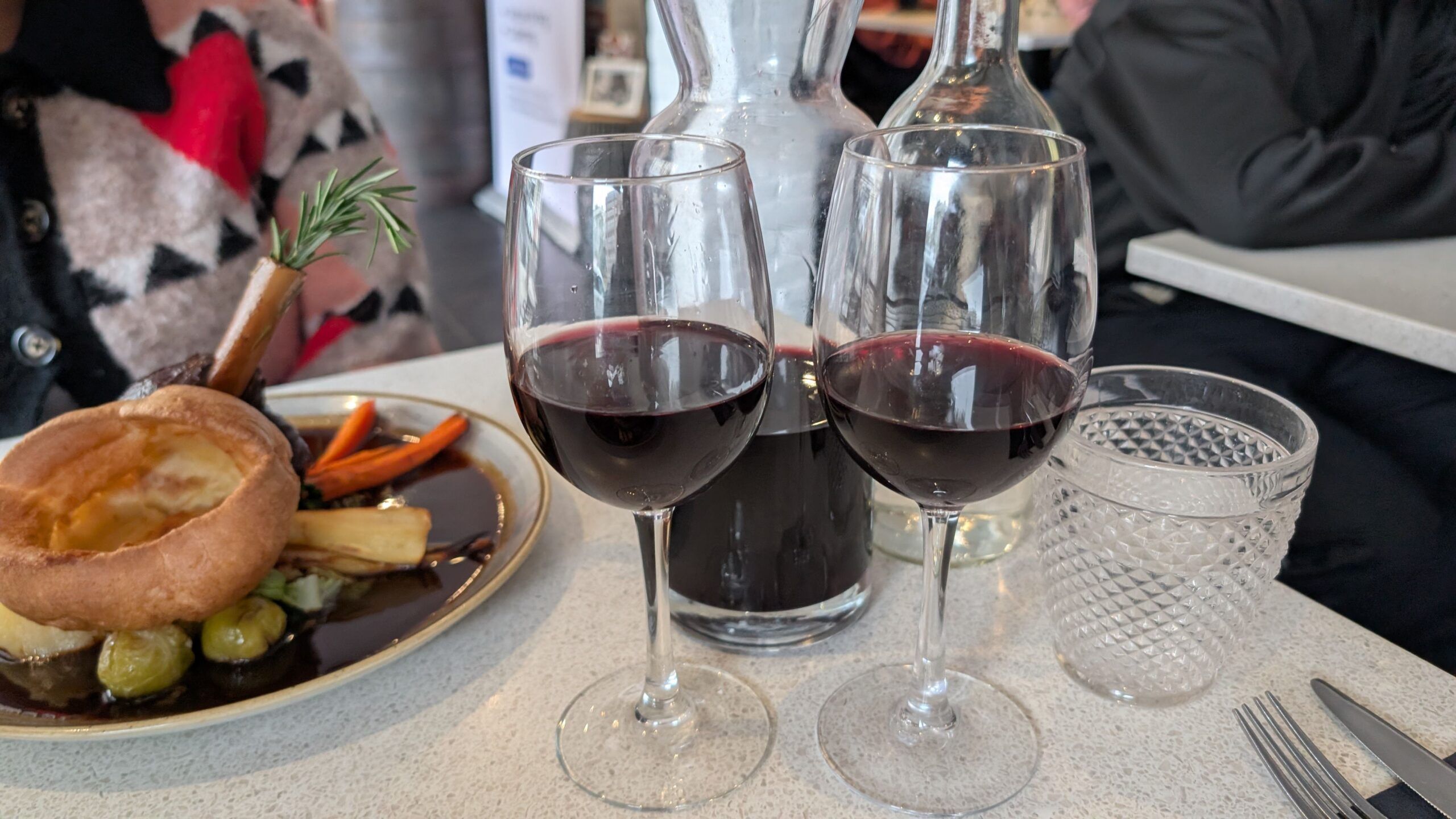 two glasses of red wine served with roast