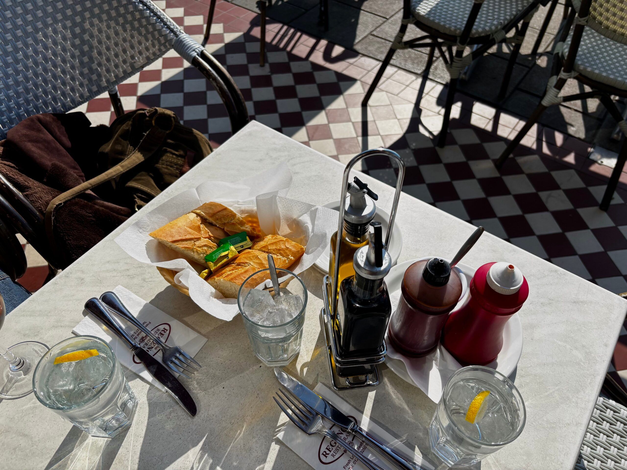 over head shot of the outdoor table, bread and butter served fist