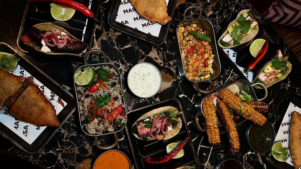 A table full of Argentinian dishes served by Masa at Tapestry in Hove