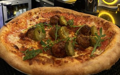 Meatball pizza on the bar at La Piazza in Hove . Italian restaurant in Hove