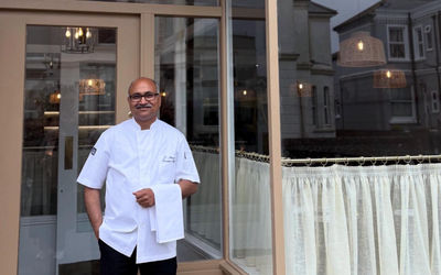 Bauji Indian Restaurant in WOrthing. Owner stood outside