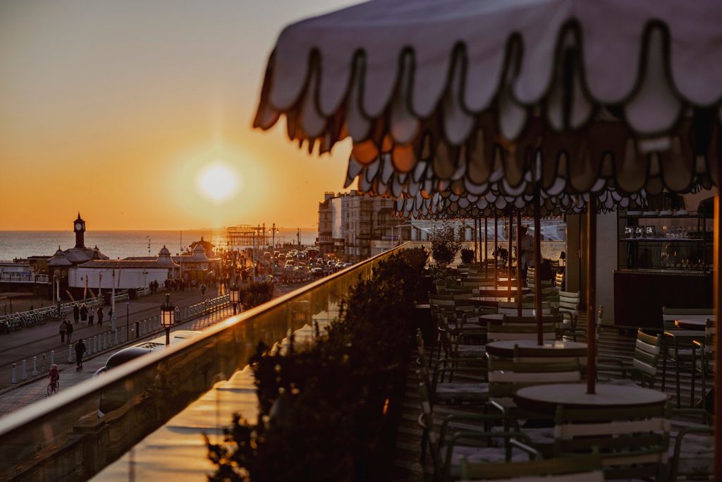 sunset views facing West from Cecconi's Italian restaurant on Brighton's seafront. Things to do in Brighton