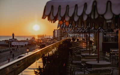 sunset views facing West from Cecconi's Italian restaurant on Brighton's seafront. Things to do in Brighton