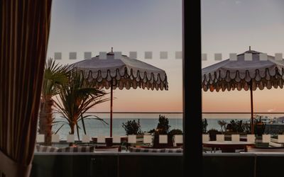 alfresco dining - Cecconi's on Brighton seafront. Sun umbrellas as part of the seaviews.