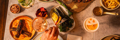 over head shot of people sharing plates