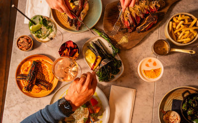 over head shot of people sharing plates