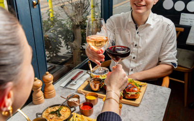 two people enjoying lunch platters and drinks at Kindling