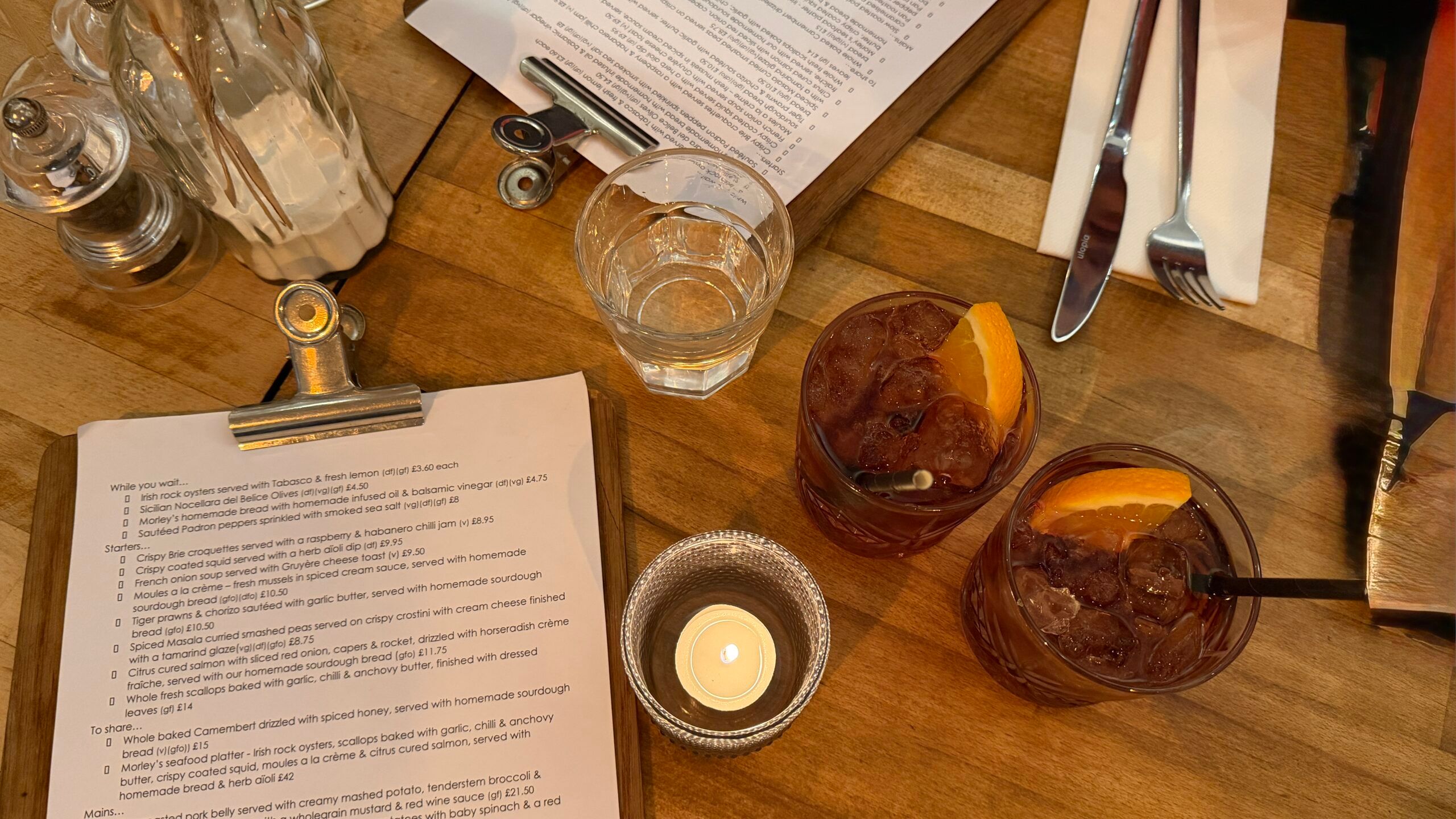 over head shot of the menu and two drinks on the table