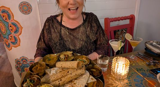 Brittany holding thali platter