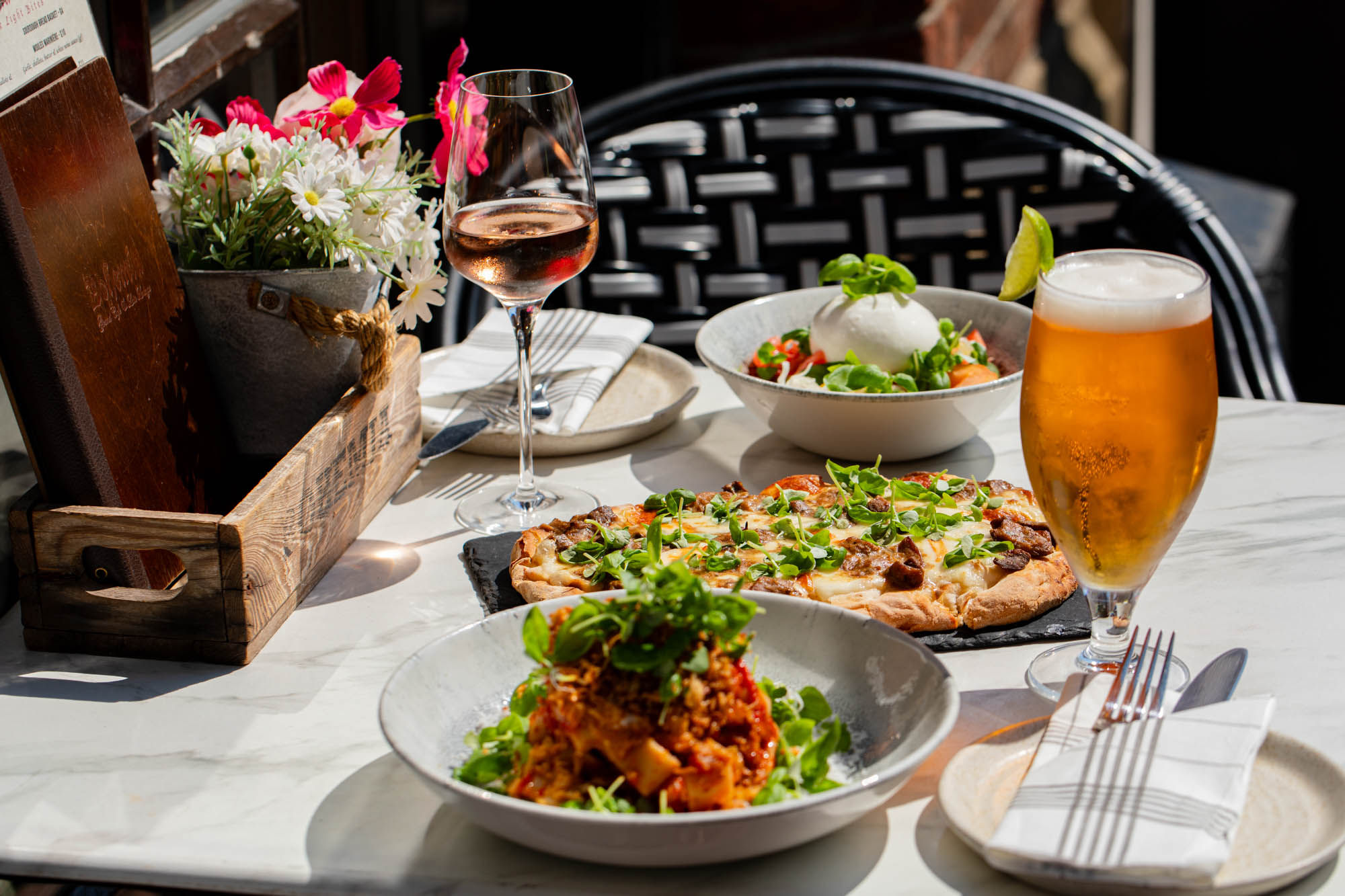 side shot of the table laid out with lunch and drinks at Bohemia