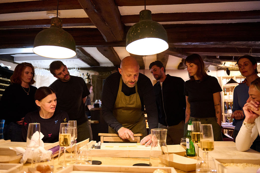 Jamie teaching a group of people pasta making at Poco Wine in Alfriston