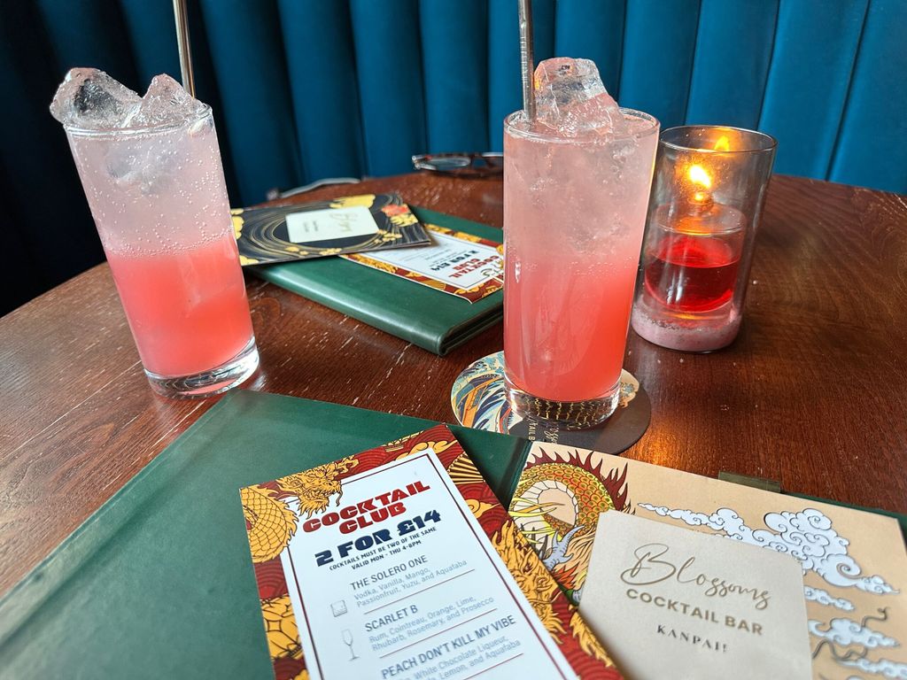 two blossoms gin drinks on the table