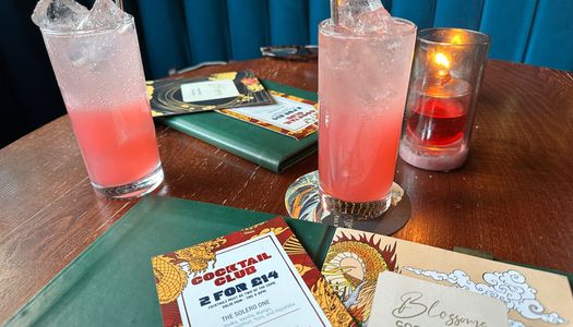 two blossoms gin drinks on the table