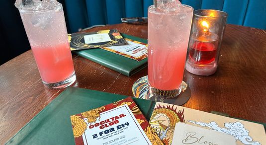 two blossoms gin drinks on the table