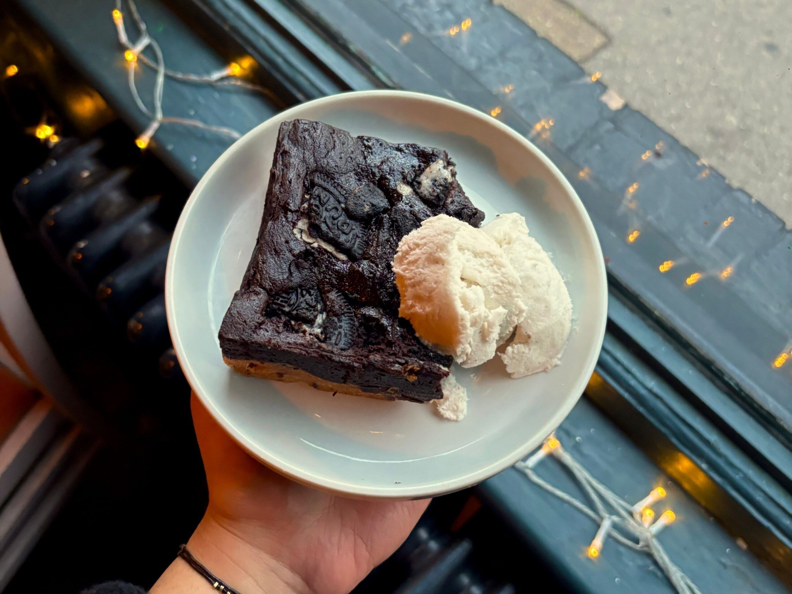 over head shot of chocolate brownie with vanilla ice cream