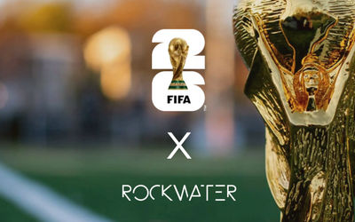an image of the world cup trophy on a blurred background. with 26 number x rockwater in white text.