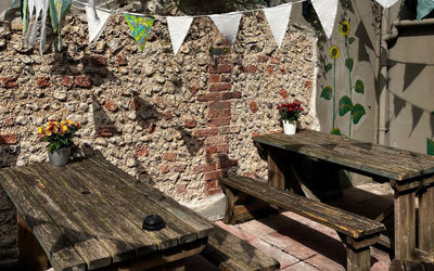 The beer garden on a sunny day with bunting.