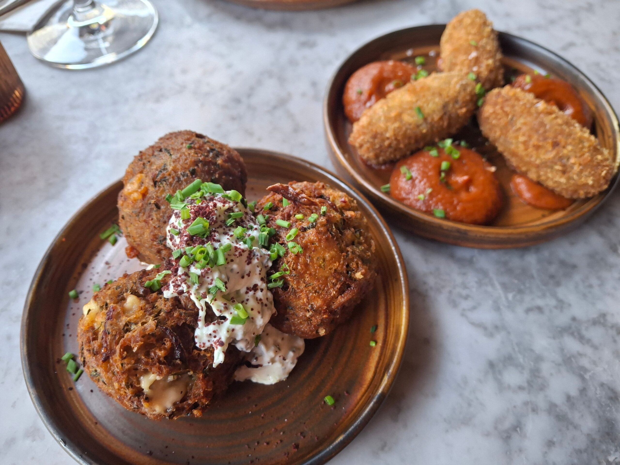 summery courgette and feta fritters served with a creamy, light tzatziki, and perfectly cooked brisket croquettes with a subtle jalapeño kick