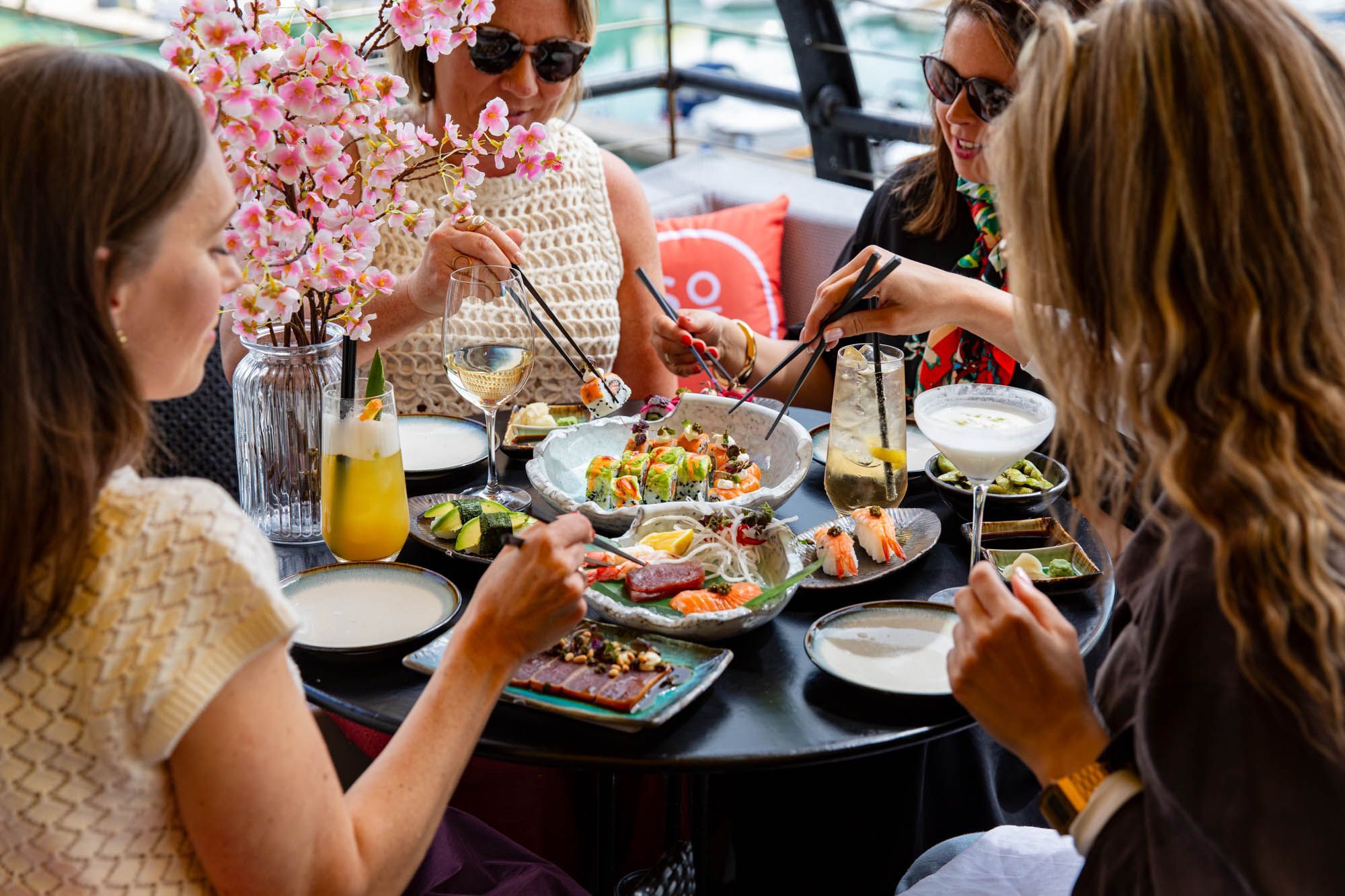 group of friends enjoying Sora sushi at Malmaison at the terrace