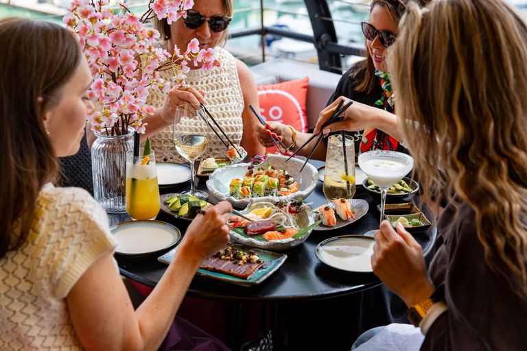 group of friends enjoying Sora sushi at Malmaison at the terrace