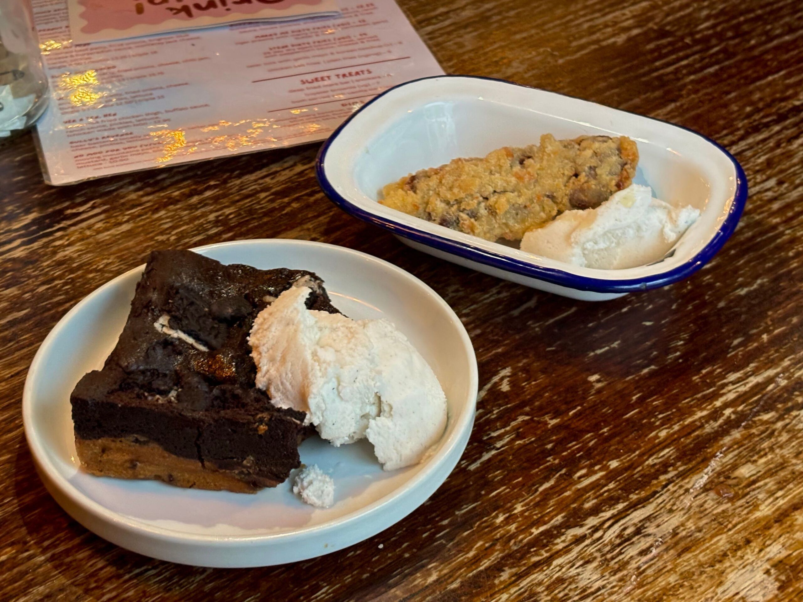 two dessets including brownie with ice cream and Gooey chocolate served with vanilla ice cream