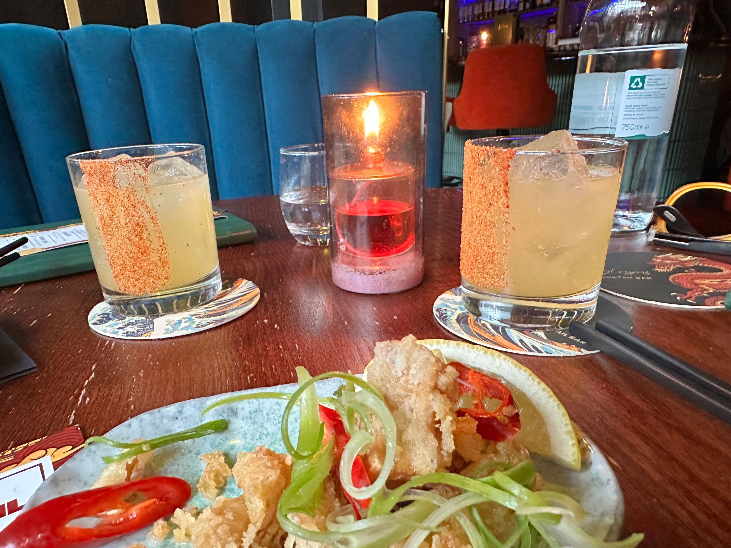 medicnina latina cocktails served on the table with small plates