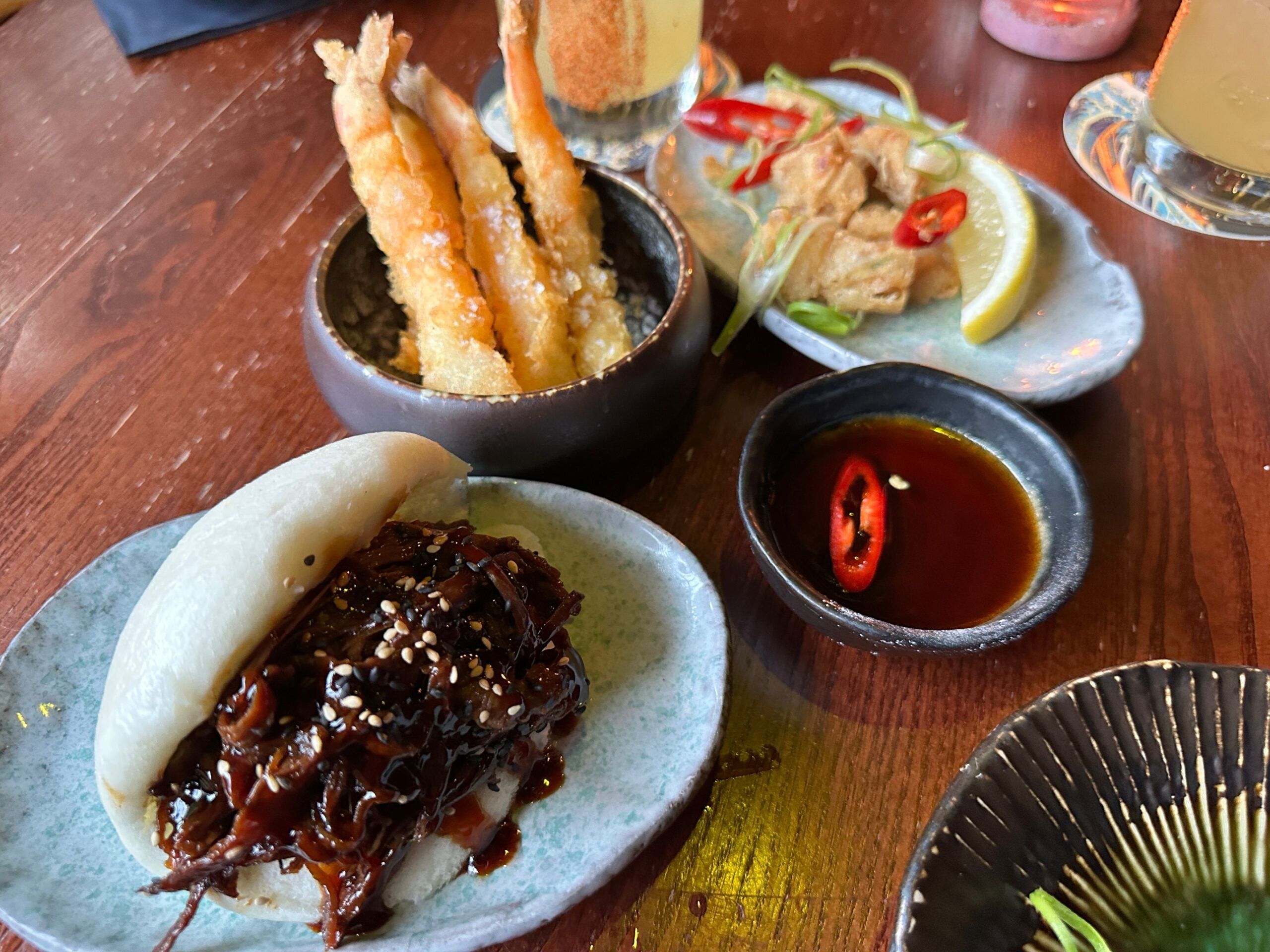 Japanese insipred small plates served on the wooden table at Blossoms Brighton