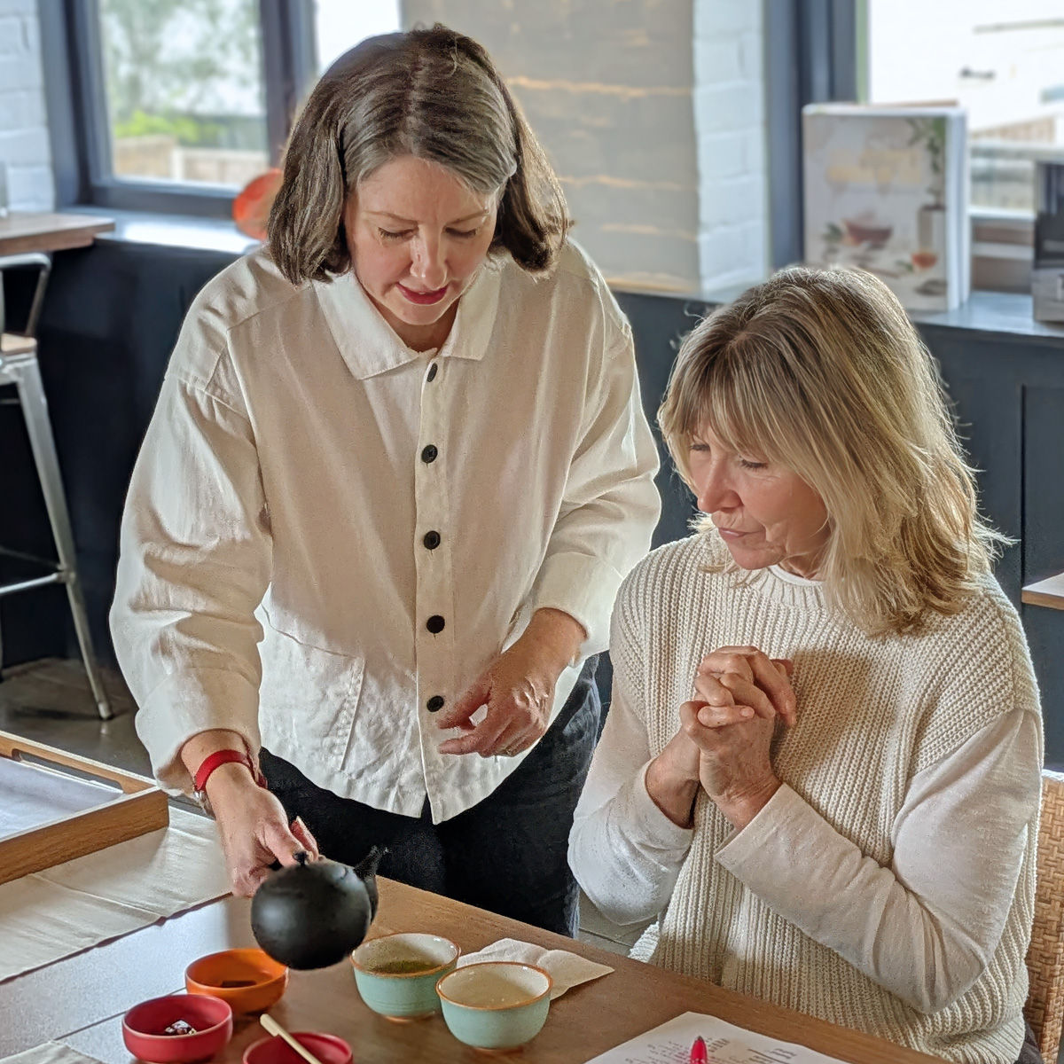 Julie at Kissako demonstrating how the tea pouring works