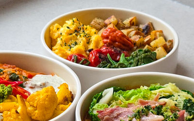 three bowls of brightly coloured salad at Kernel Canteen in the Cicus Street area of Brighton
