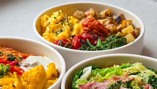 three bowls of brightly coloured salad at Kernel Canteen in the Cicus Street area of Brighton